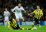 Mats Hummels (L) of Borussia Dortmund fouls Cristiano Ronaldo of Real Madrid during the UEFA Champions League group D match between Real Madrid and Borussia Dortmund at Estadio Santiago Bernabeu on November 6, 2012 in Madrid, Spain.  (Photo by Jasper Juinen/Getty Images)